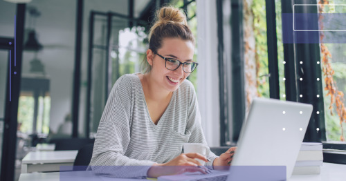 person using laptop and smiling