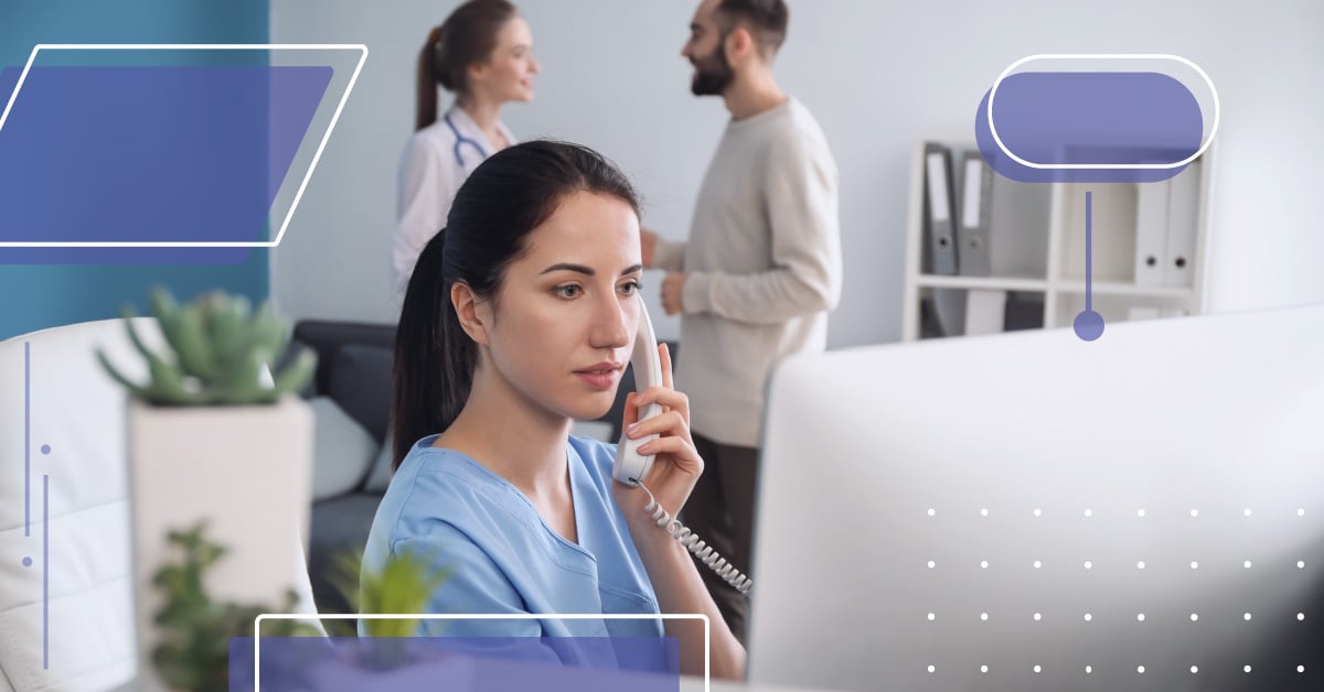 Receptionist talking on the phone in front of her computer at a dental office